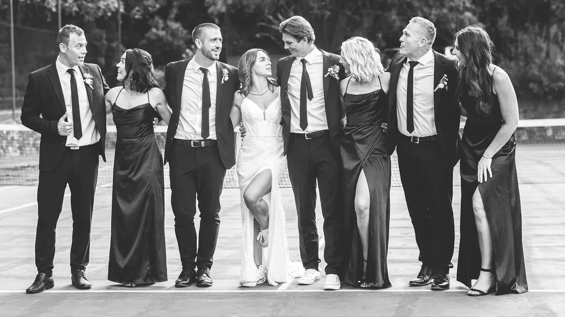 Wedding party smiling for portrait